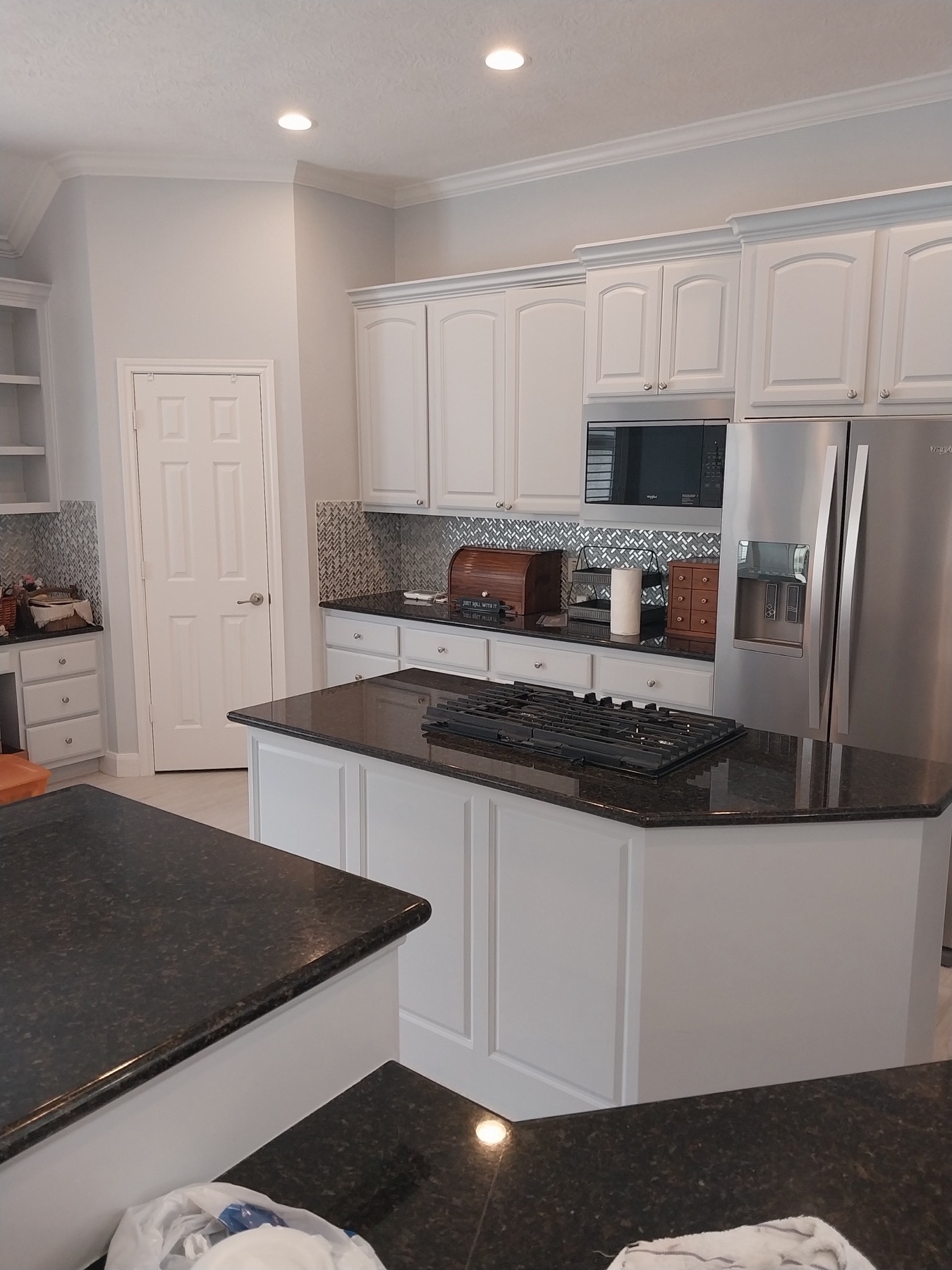 White Kitchen Cabinet Painting project photo in Houston Area, TX